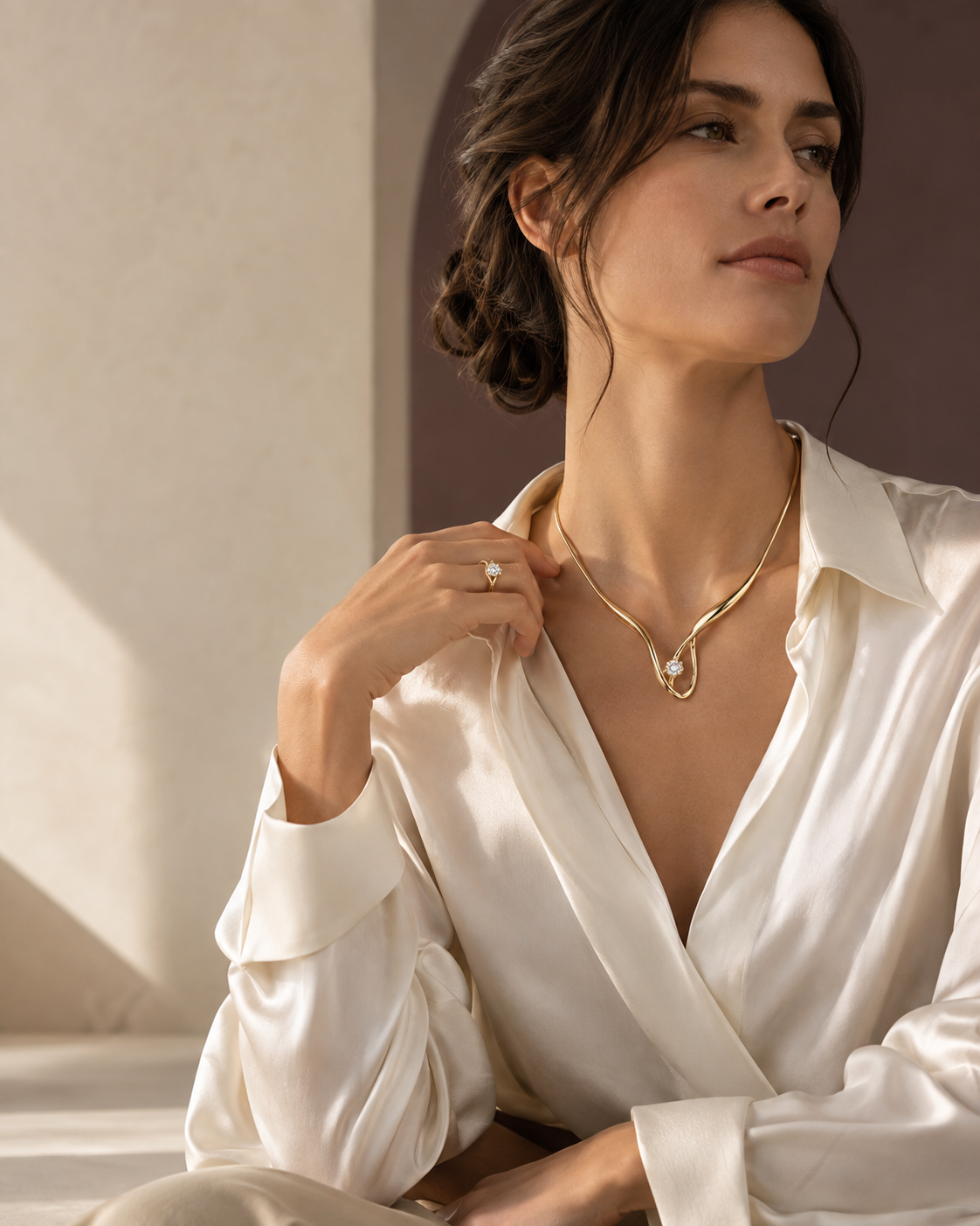 Fine jewelry worn with an ivory silk blouse